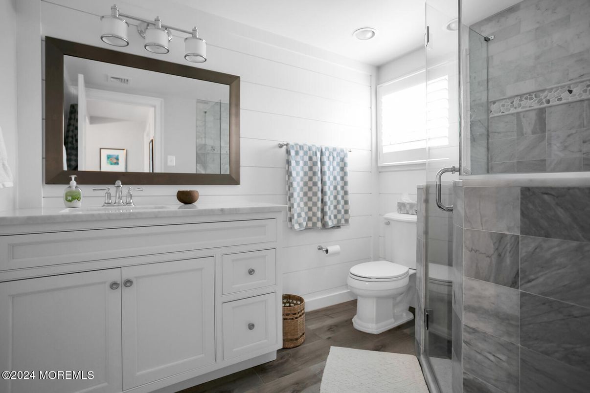 Bathroom, Glass Shower, Interior, Marble Walls, Recessed Lighting, Wood Texture Flooring