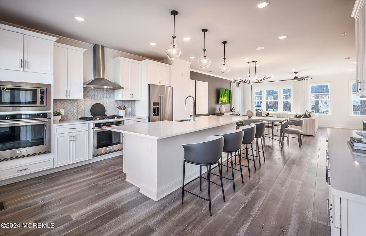 Dining room, Interior, Kitchen, Pendant Lights, Recessed Lighting, Stainless Steel Appliances, Wood Texture Flooring