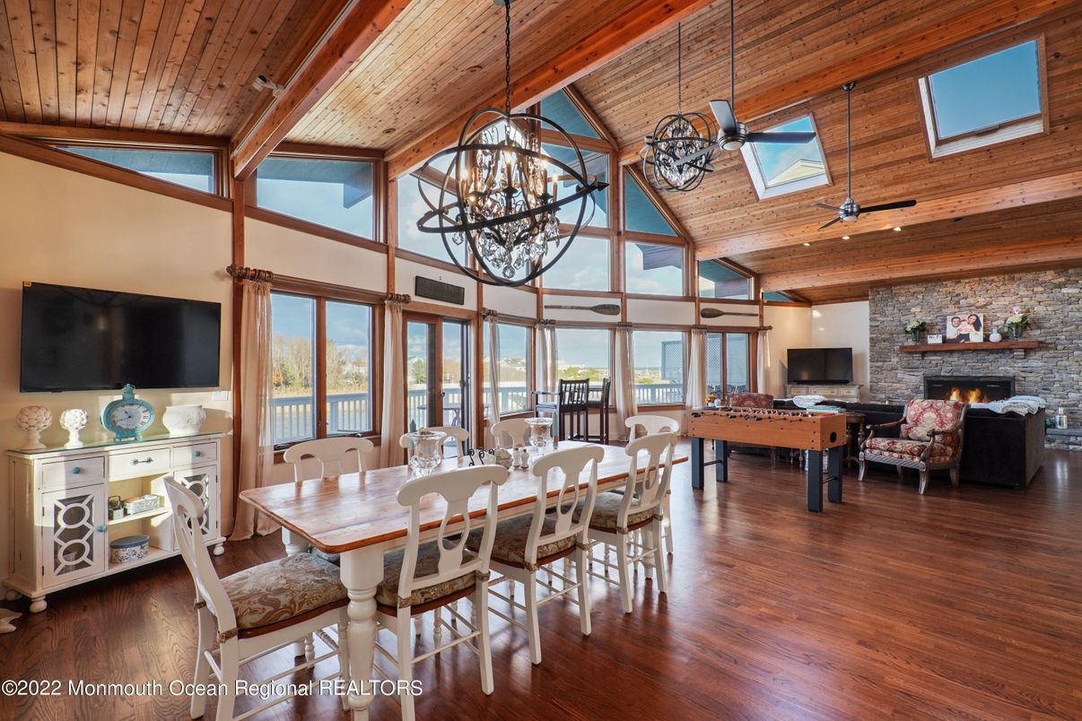 Chandelier, Dining room, Fireplace, Interior, Living room, Pendant Lights, Stone Walls, Wooden Beams, Wooden Ceilings, Wood Texture Flooring