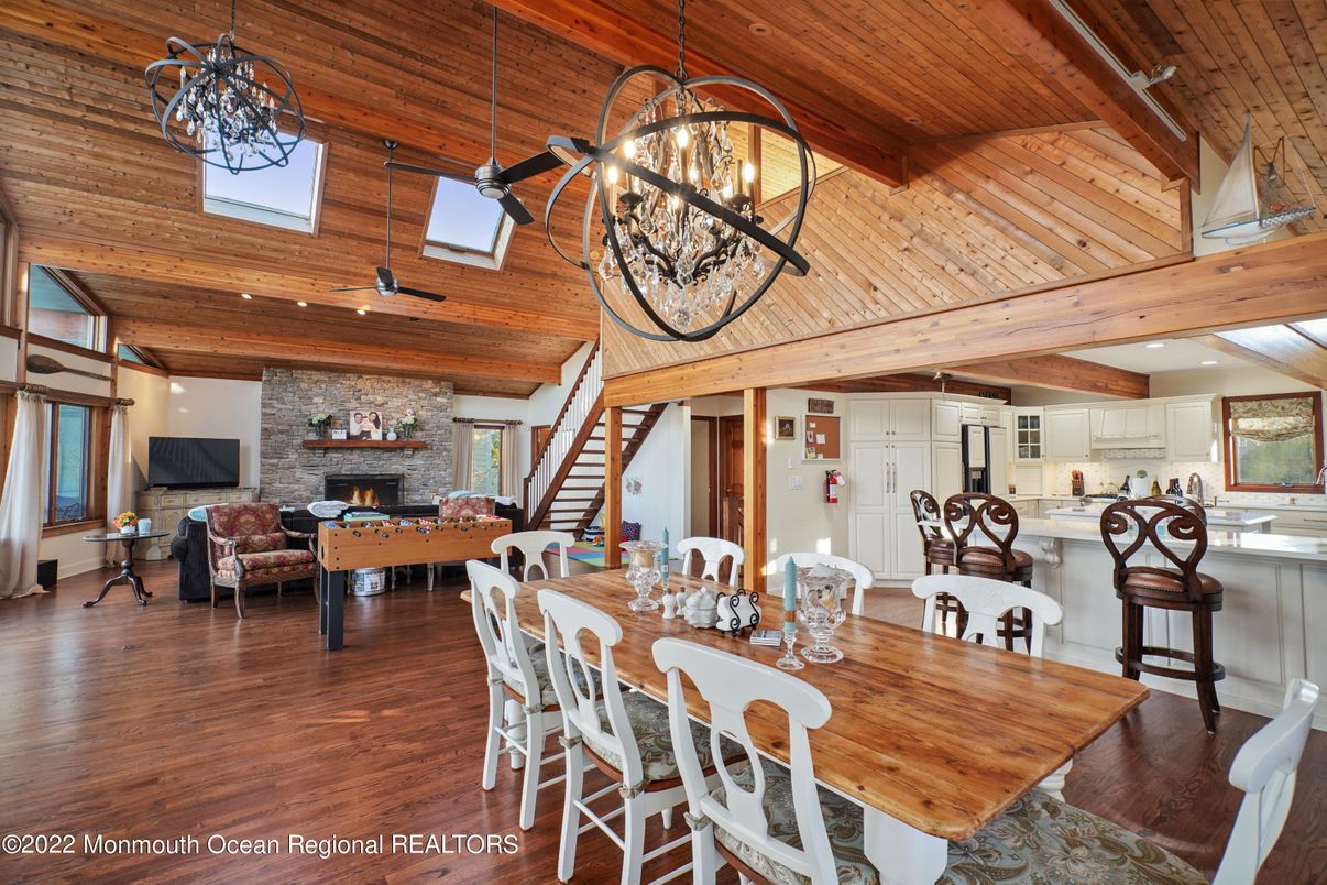 Chandelier, Dining room, Fireplace, Interior, Kitchen, Living room, Pendant Lights, Stone Walls, Wooden Beams, Wooden Ceilings, Wood Texture Flooring