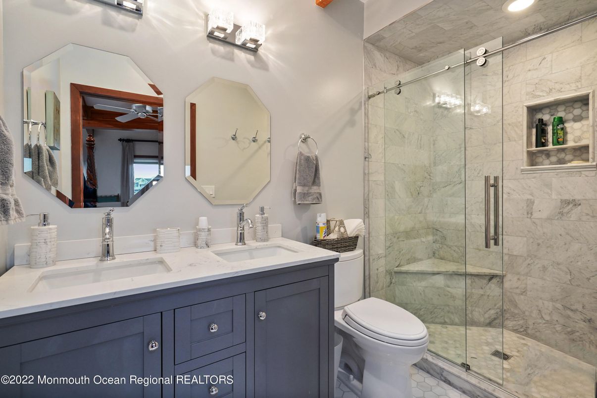 Bathroom, Dual Sink Vanities, Glass Shower, Interior, Marble Walls, Recessed Lighting