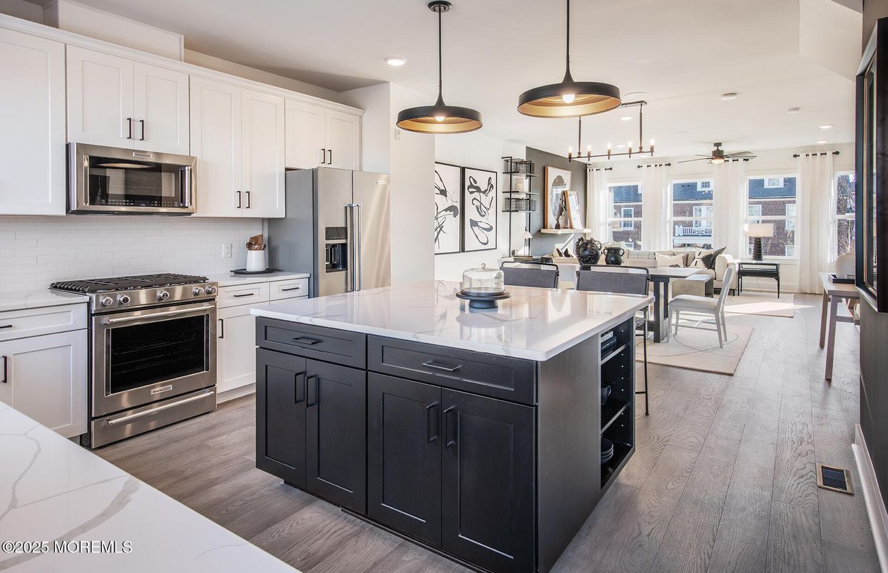 Dining room, Interior, Kitchen, Living room, Pendant Lights, Recessed Lighting, Stainless Steel Appliances, Wood Texture Flooring