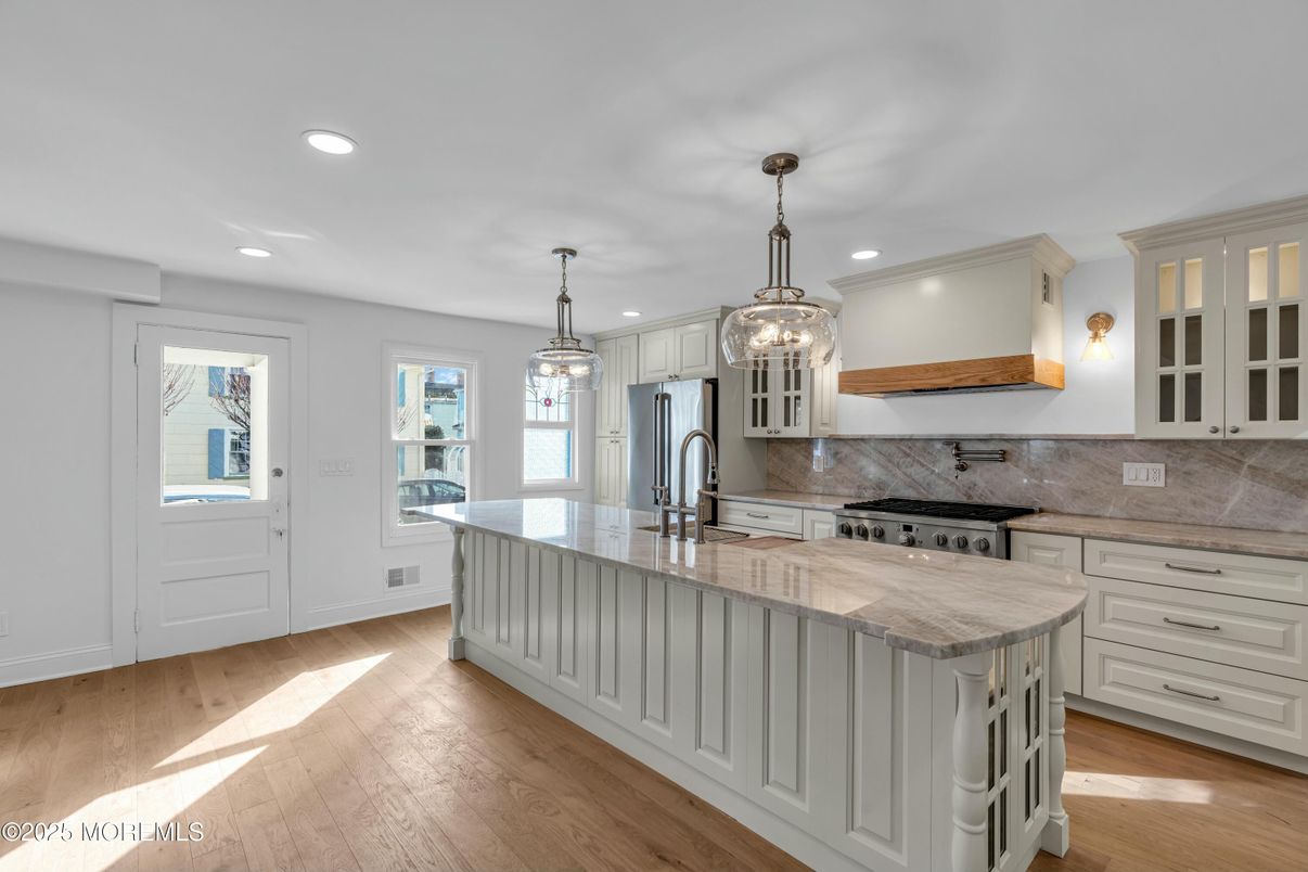 Chandelier, Interior, Kitchen, Pendant Lights, Recessed Lighting, Stainless Steel Appliances, Wood Texture Flooring