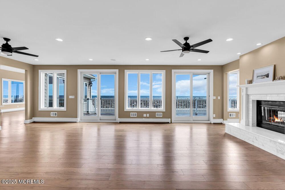 Empty room, Fireplace, Interior, Recessed Lighting, Water, Wood Texture Flooring