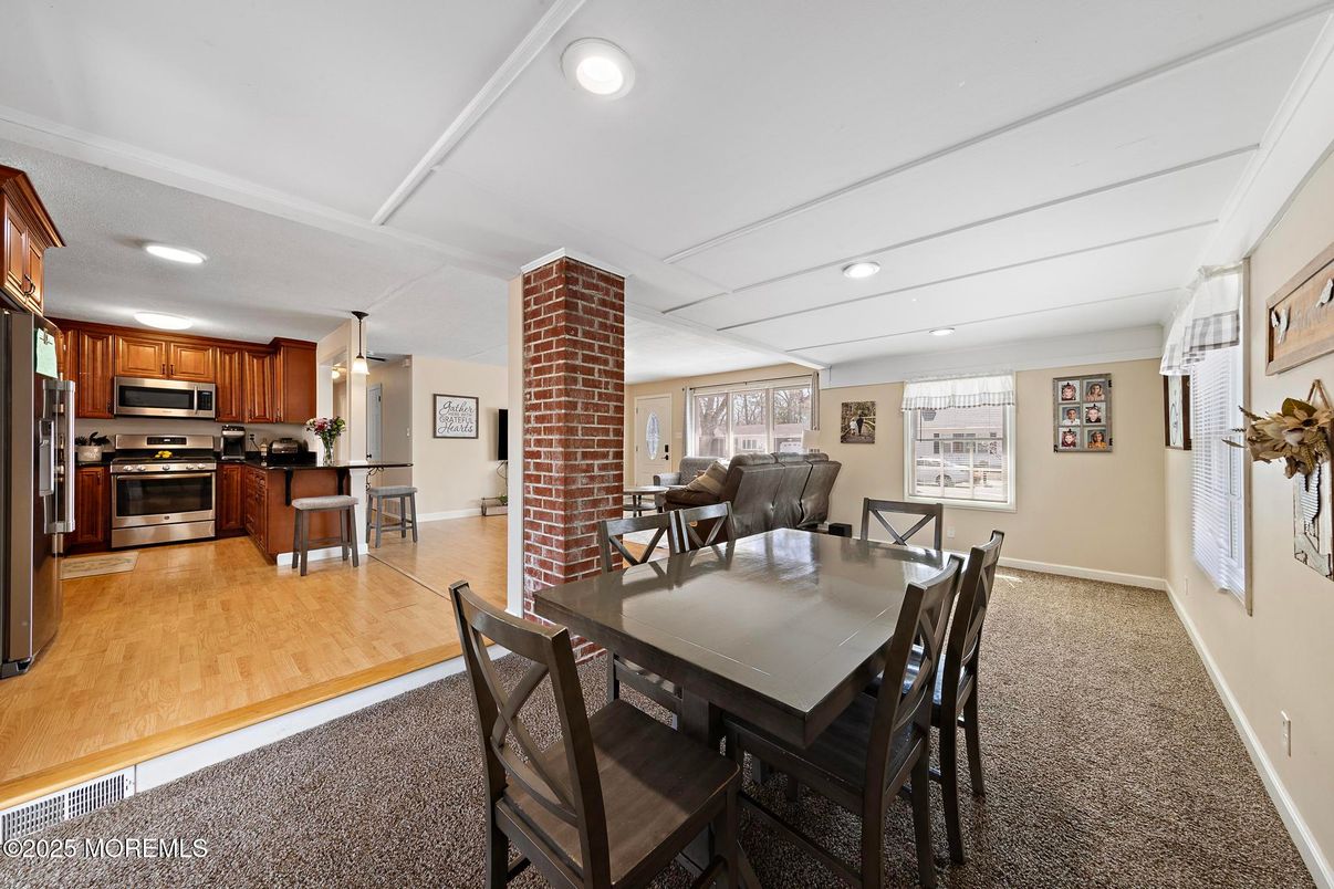 Dining room, Interior, Kitchen, Recessed Lighting, Stainless Steel Appliances, Stone Walls, Wood Texture Flooring