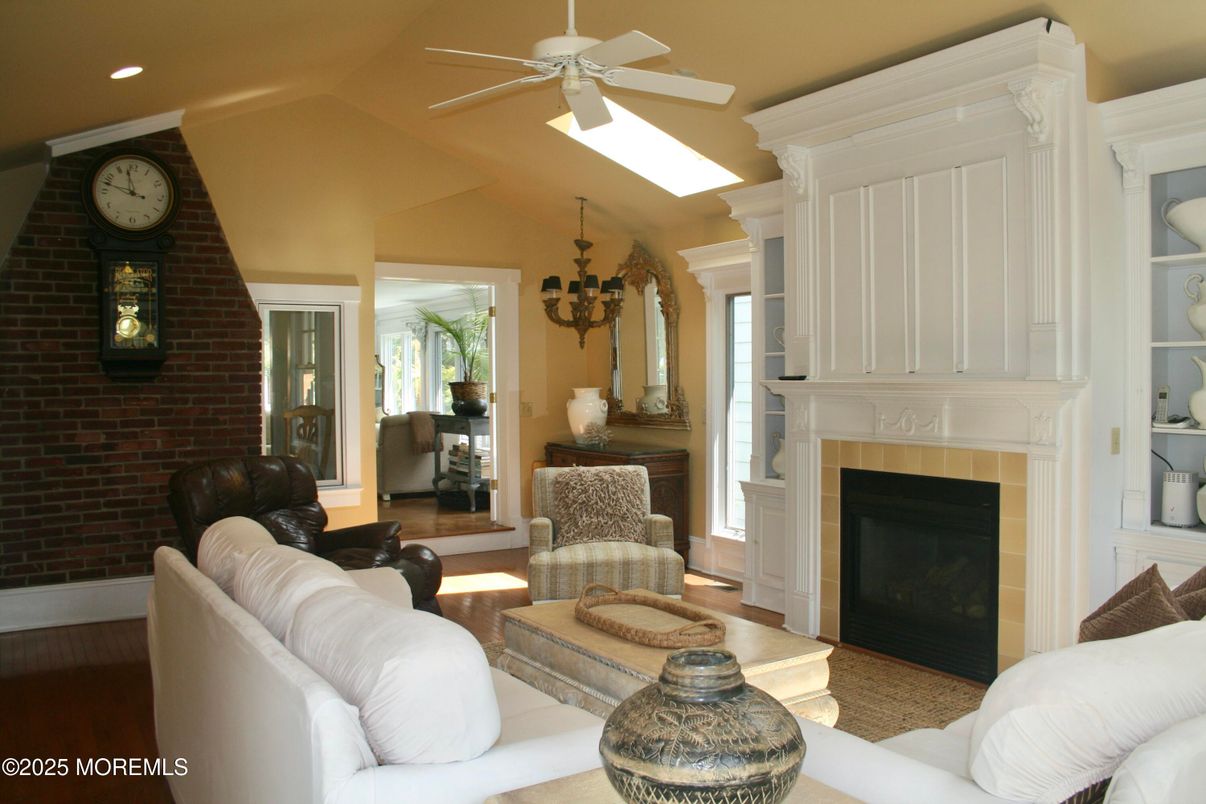 Fireplace, Interior, Living room, Recessed Lighting, Stone Walls, Wood Texture Flooring