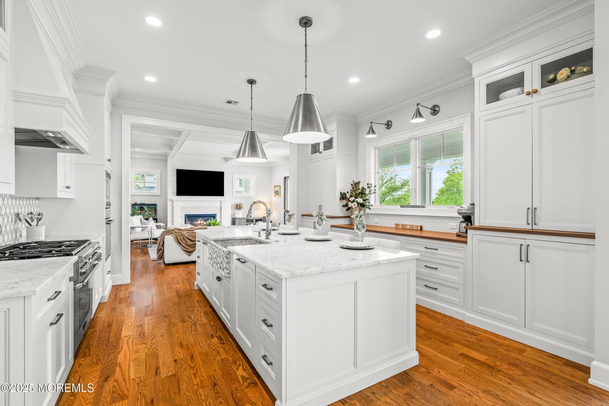 Fireplace, Interior, Kitchen, Living room, Pendant Lights, Recessed Lighting, Stainless Steel Appliances, Wood Texture Flooring
