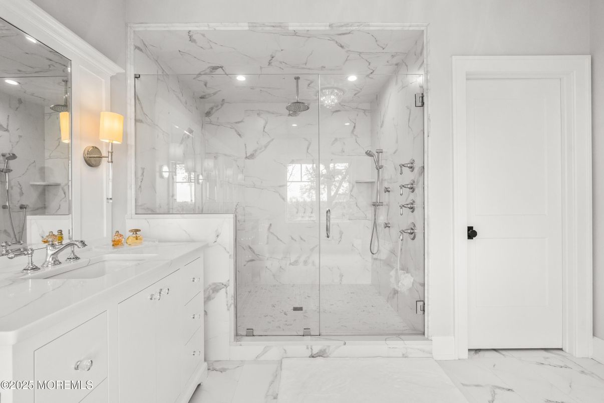 Bathroom, Dual Sink Vanities, Glass Shower, Interior, Marble, Marble Walls, Recessed Lighting