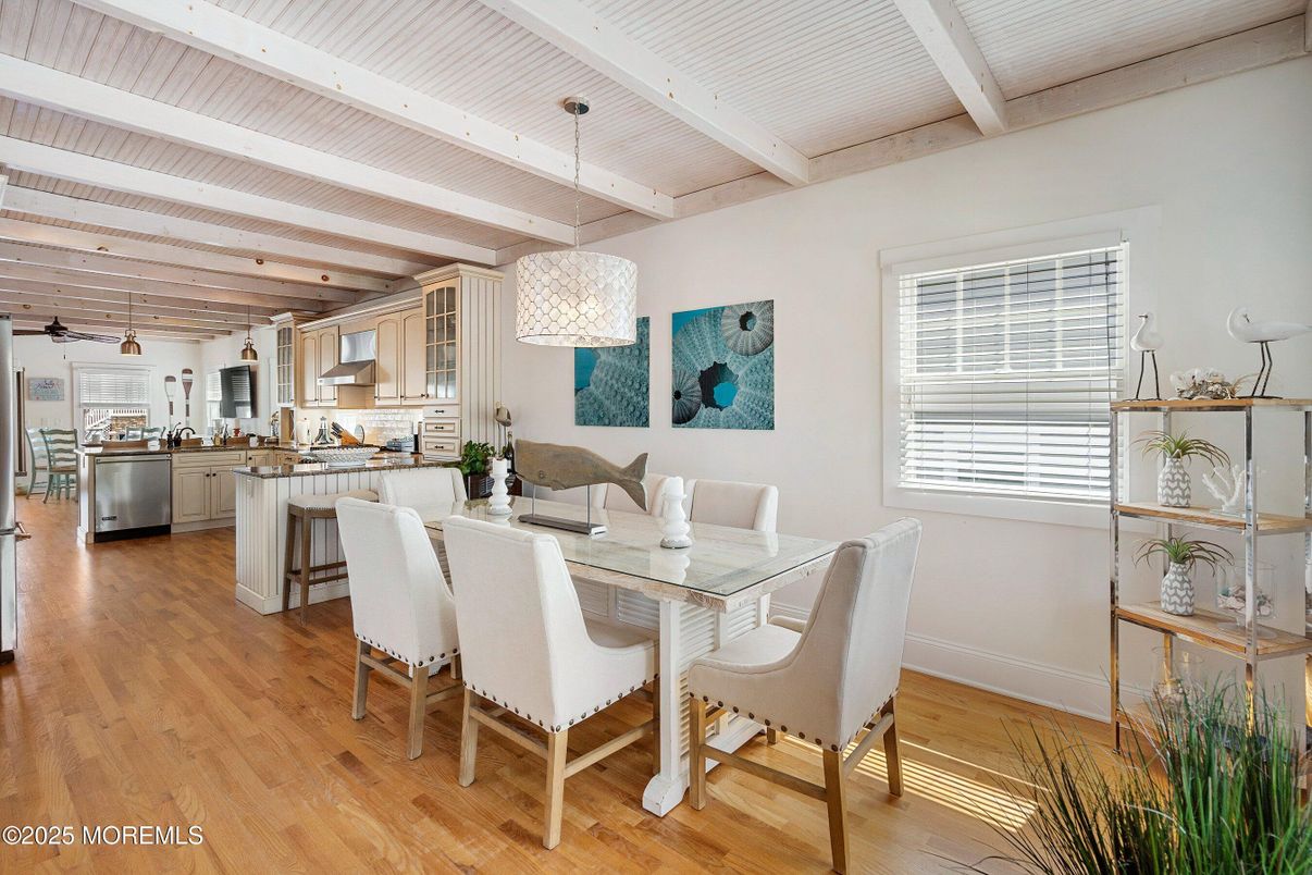 Chandelier, Dining room, Interior, Kitchen, Pendant Lights, Stainless Steel Appliances, Wooden Beams, Wood Texture Flooring
