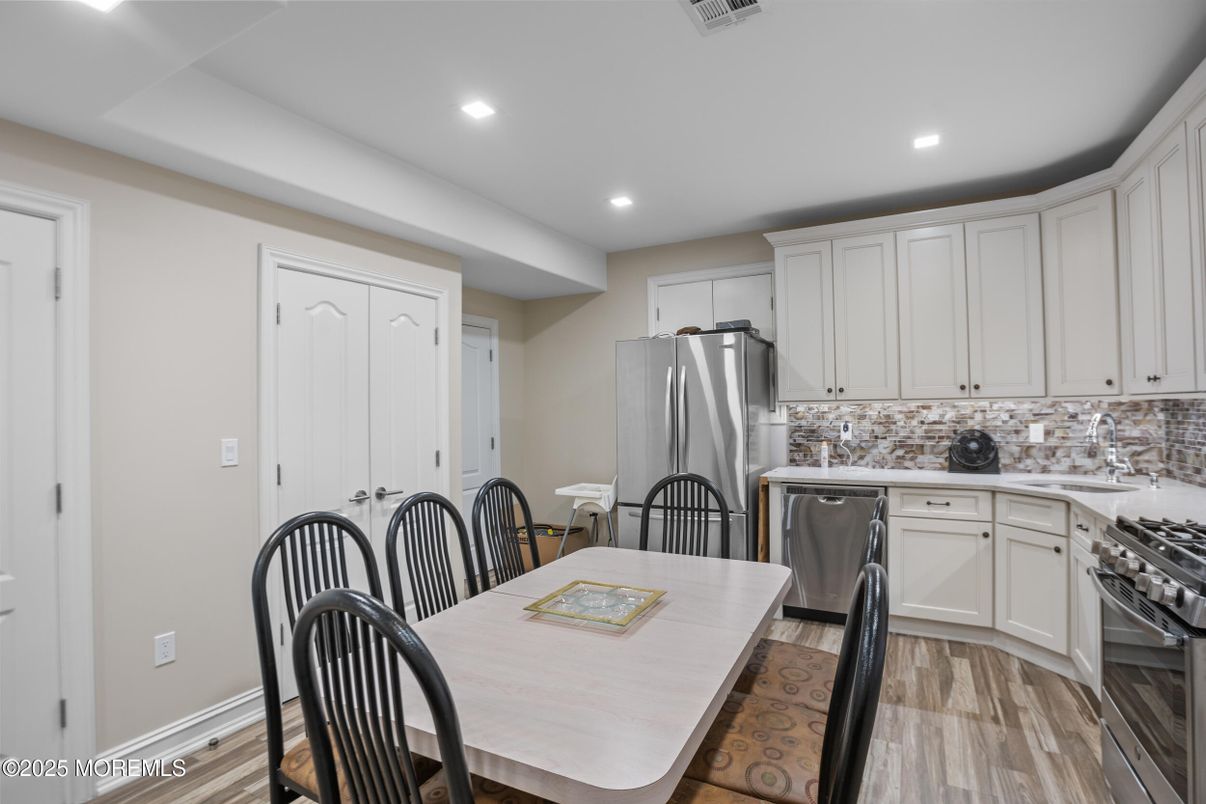 Dining room, Interior, Kitchen, Recessed Lighting, Stainless Steel Appliances, Wood Texture Flooring