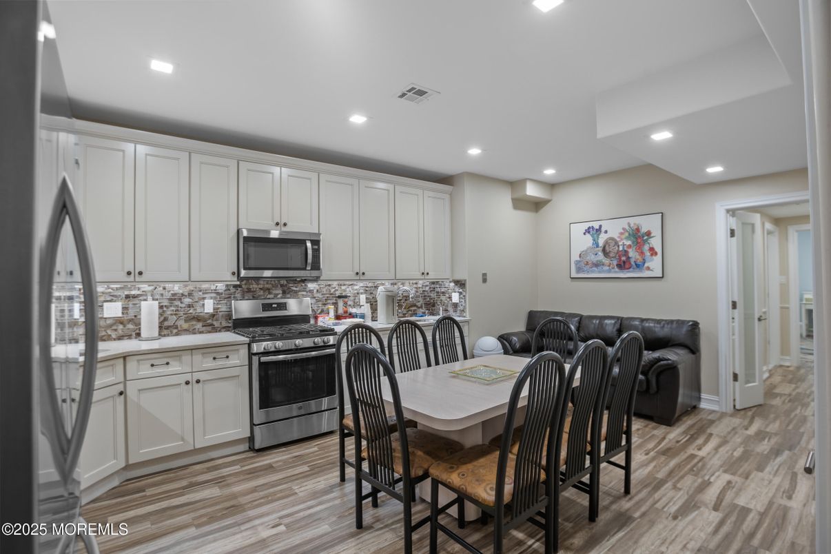 Dining room, Interior, Kitchen, Recessed Lighting, Stainless Steel Appliances, Wood Texture Flooring