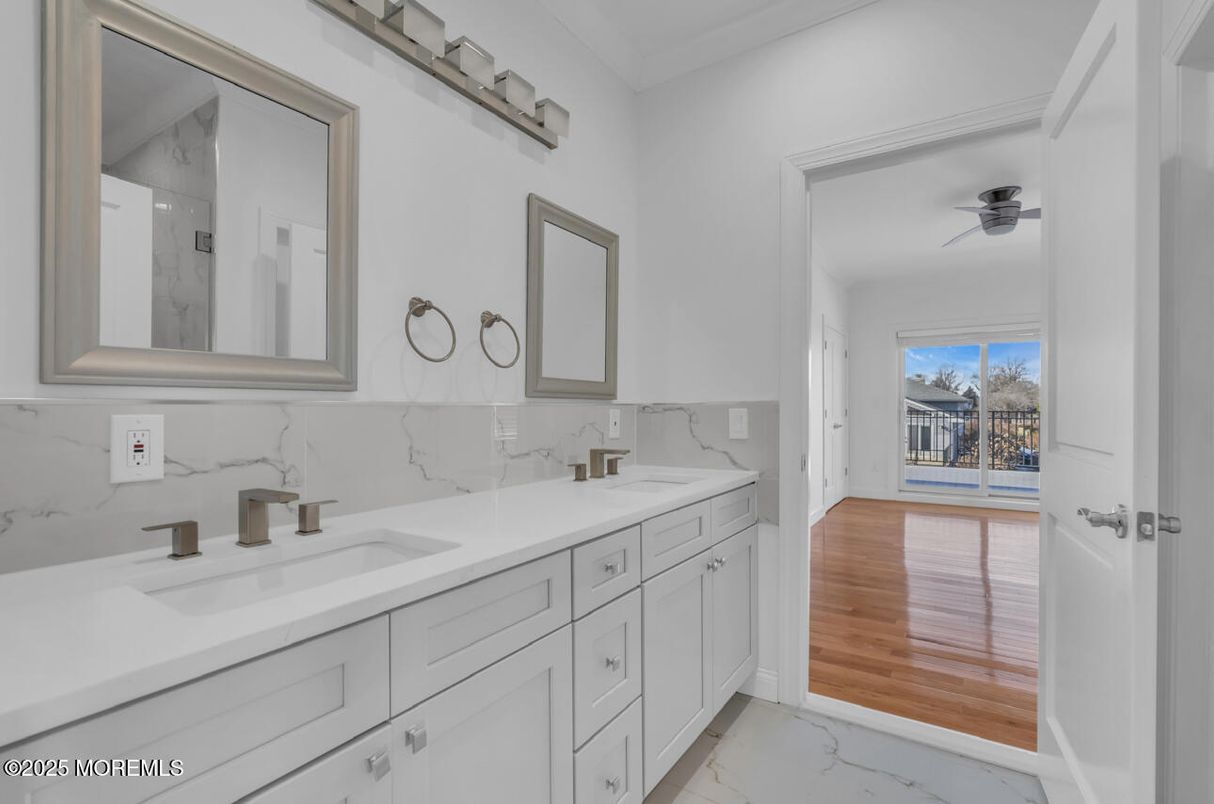 Bathroom, Dual Sink Vanities, Interior, Marble, Marble Walls, Wood Texture Flooring