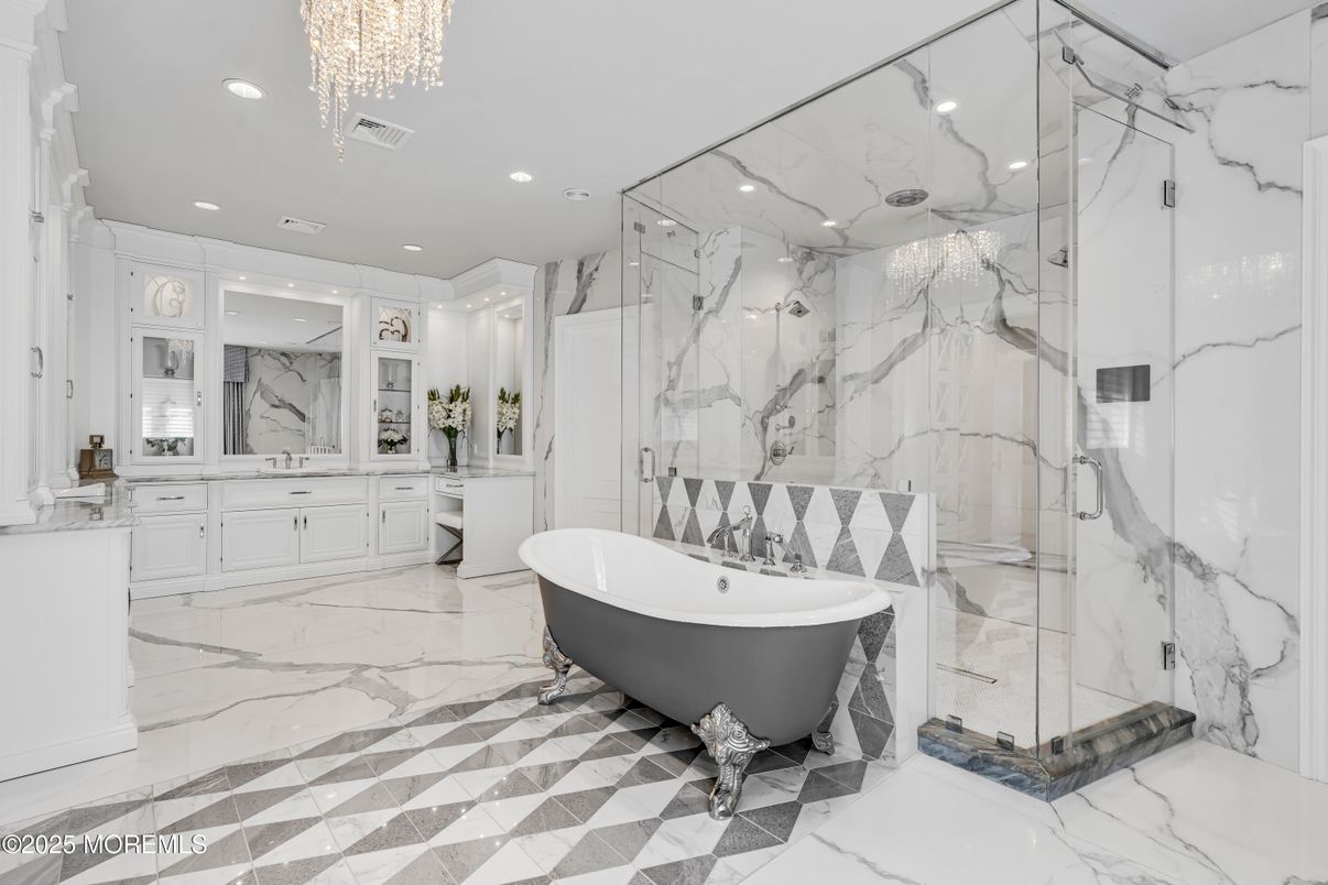 Bathroom, Chandelier, Free Standing Baths, Glass Shower, Interior, Marble, Marble Walls, Recessed Lighting