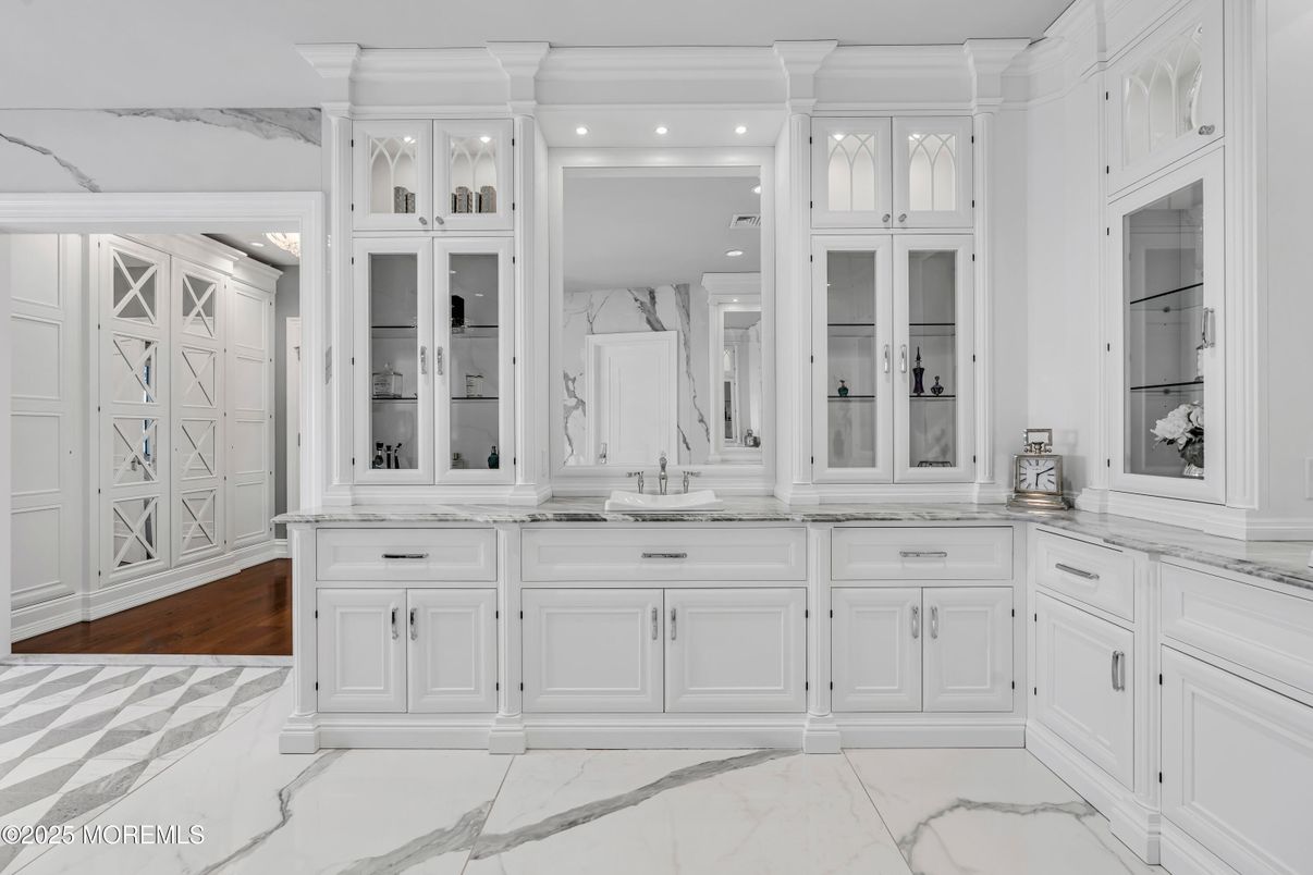 Bathroom, Dual Sink Vanities, Interior, Marble, Marble Walls, Recessed Lighting, Wood Texture Flooring