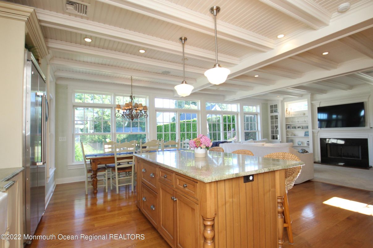 Chandelier, Dining room, Fireplace, Interior, Pendant Lights, Recessed Lighting, Wood Texture Flooring