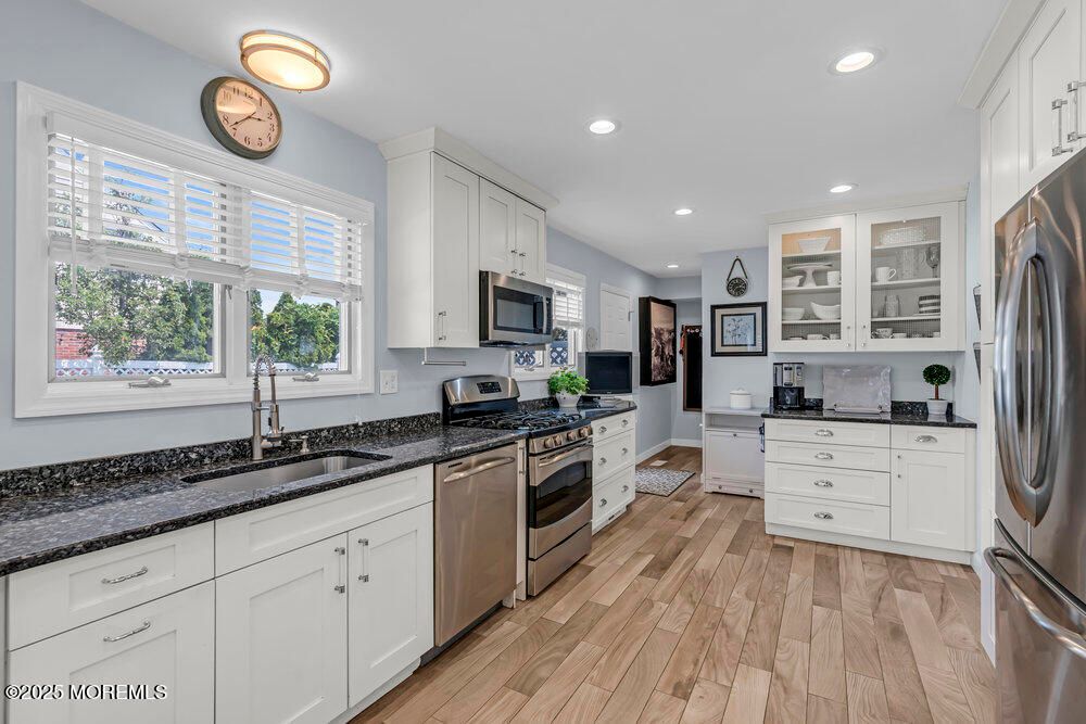 Interior, Kitchen, Recessed Lighting, Stainless Steel Appliances, Washer, Wood Texture Flooring