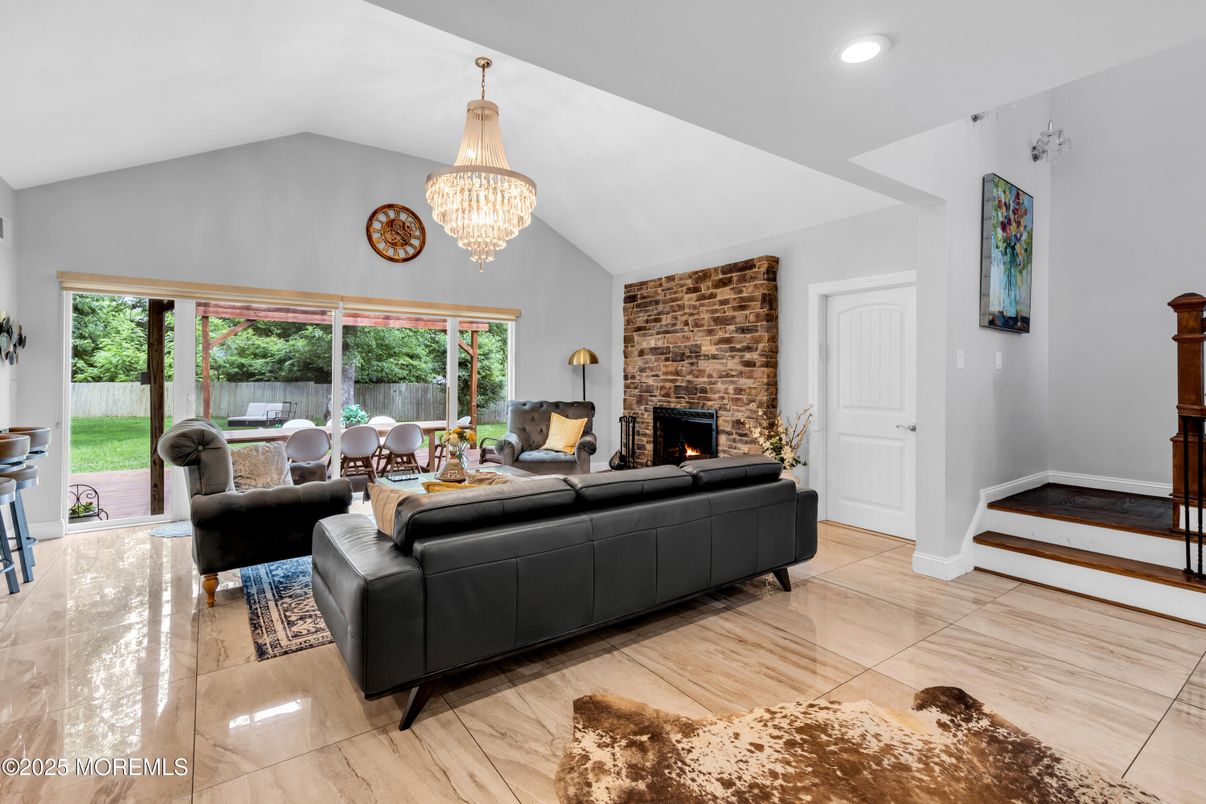 Chandelier, Dining room, Fireplace, Interior, Living room, Recessed Lighting, Stone Walls