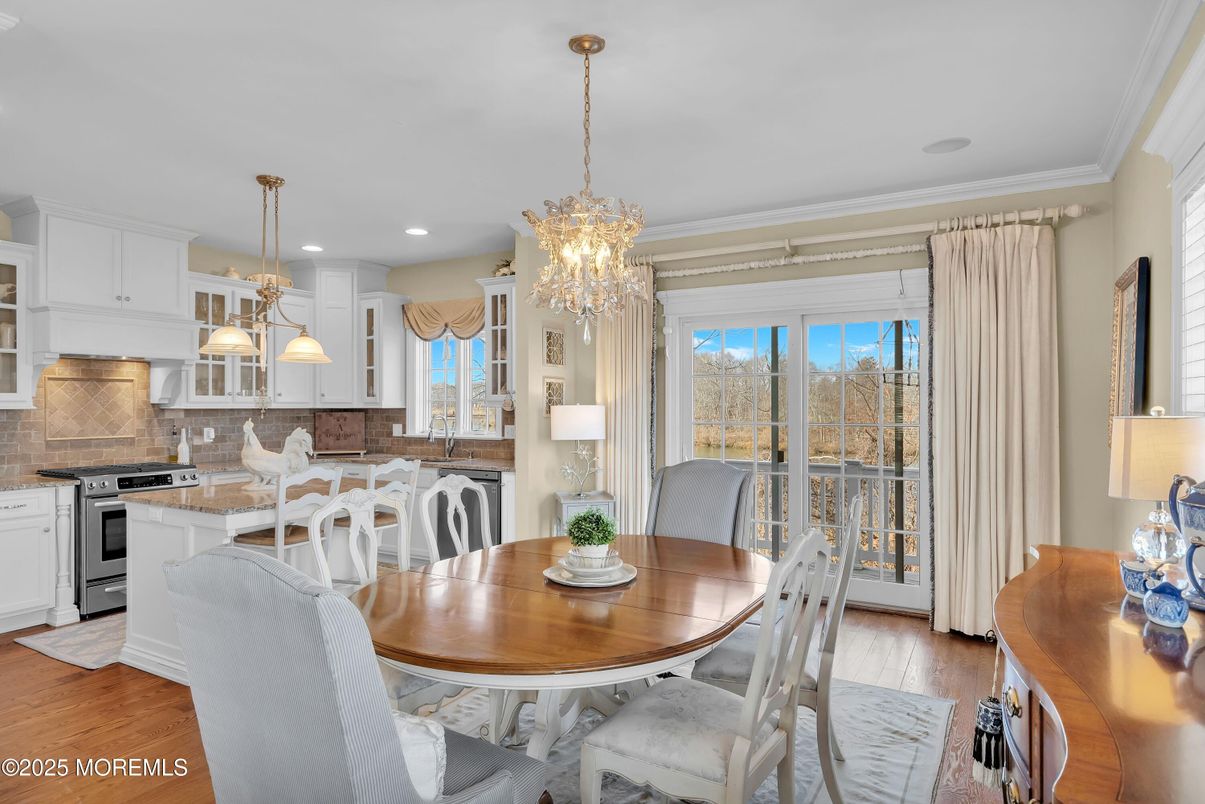 Chandelier, Dining room, Interior, Kitchen, Pendant Lights, Recessed Lighting, Stainless Steel Appliances, Wood Texture Flooring