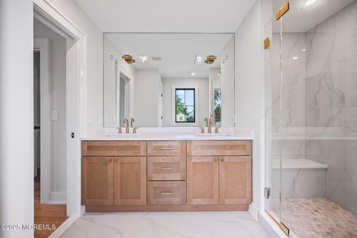 Bathroom, Dual Sink Vanities, Glass Shower, Interior, Marble, Marble Walls, Recessed Lighting