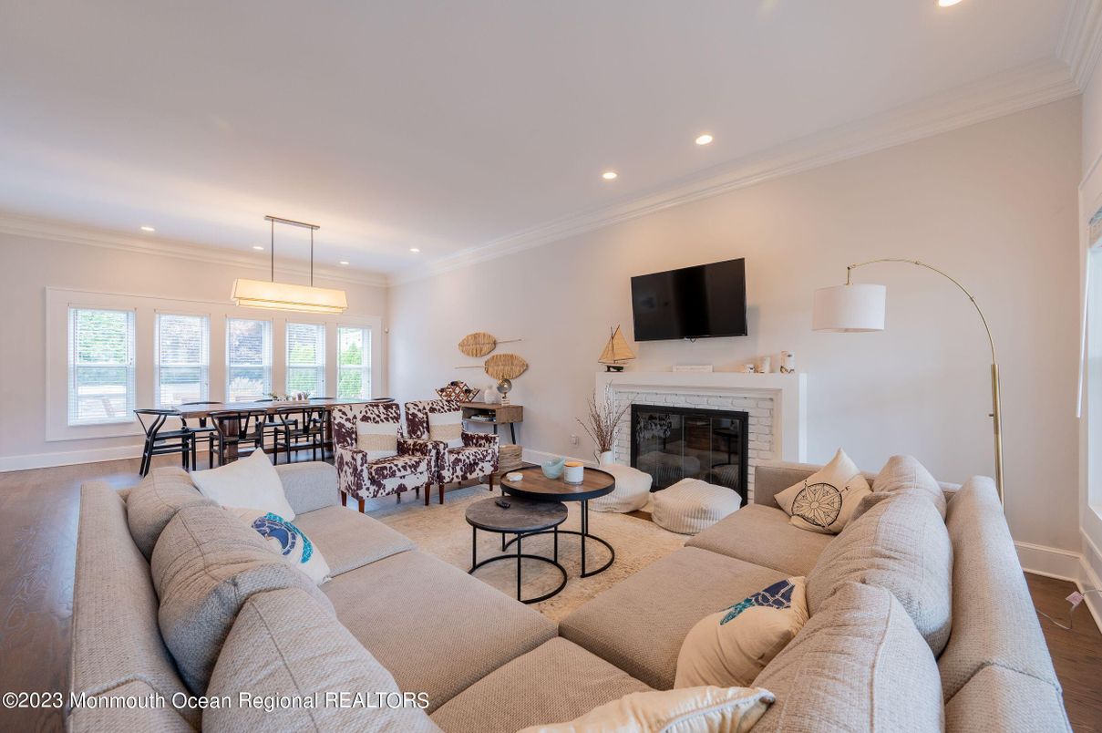 Dining room, Fireplace, Interior, Living room, Pendant Lights, Recessed Lighting, Wood Texture Flooring