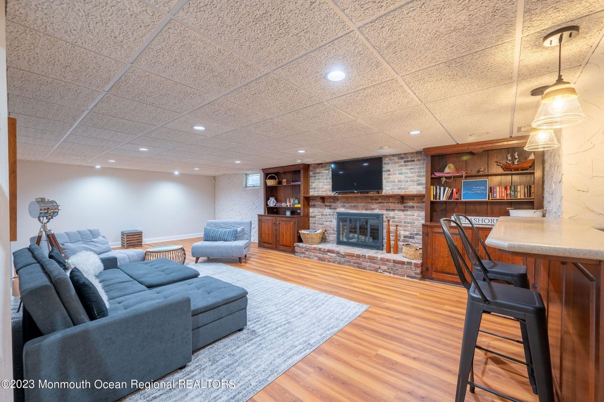 Fireplace, Interior, Pendant Lights, Recessed Lighting, Stone Walls, Wood Texture Flooring