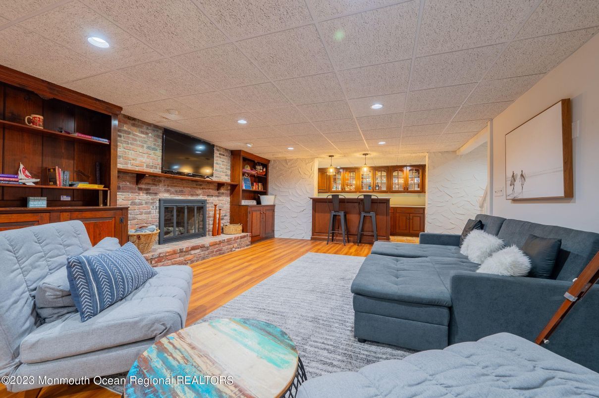 Fireplace, Interior, Living room, Pendant Lights, Recessed Lighting, Stone Walls, Wood Texture Flooring