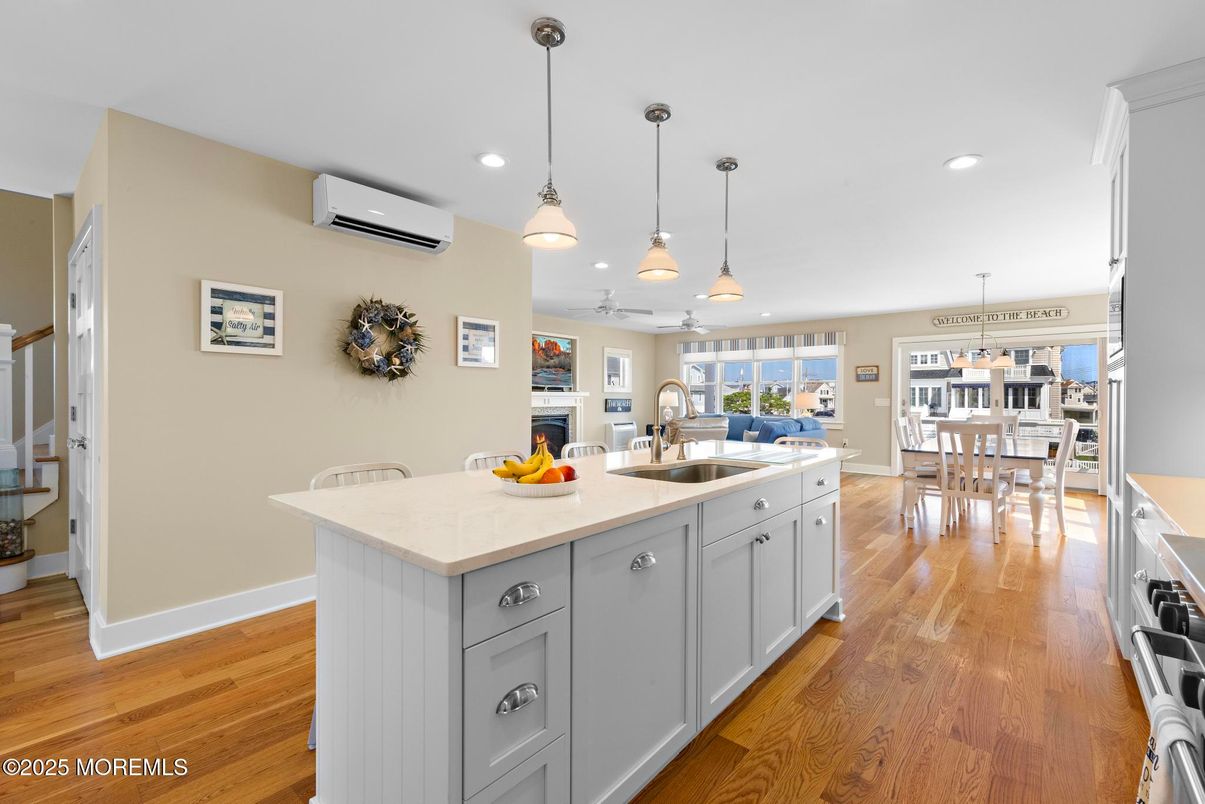 Dining room, Fireplace, Interior, Kitchen, Pendant Lights, Recessed Lighting, Wood Texture Flooring