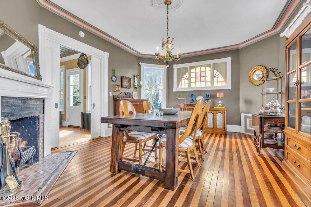 Chandelier, Dining room, Fireplace, Interior, Pendant Lights, Wood Texture Flooring