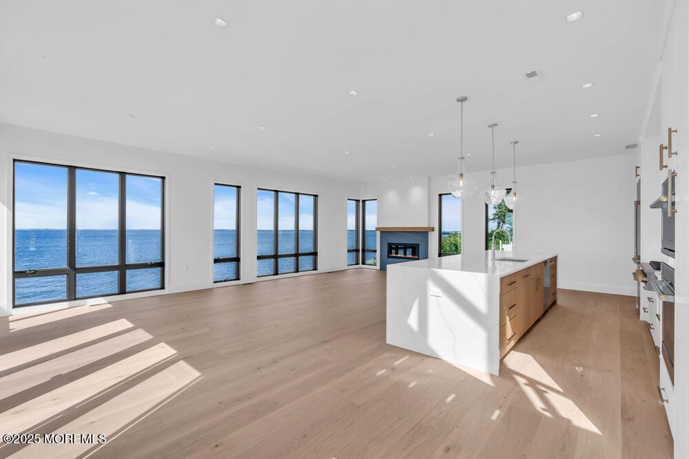 Fireplace, Interior, Kitchen, Pendant Lights, Recessed Lighting, Water, Wood Texture Flooring
