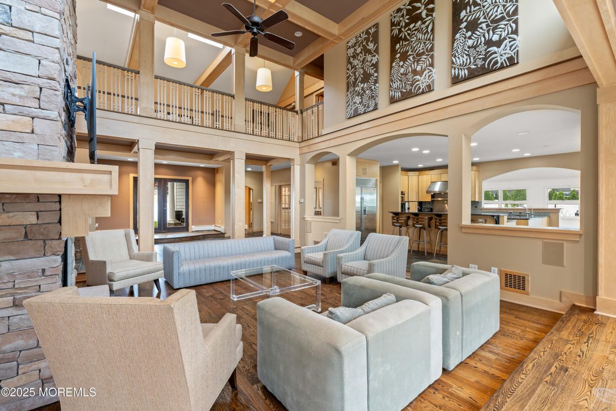 Fireplace, Interior, Kitchen, Living room, Recessed Lighting, Stainless Steel Appliances, Stone Walls, Wood Texture Flooring