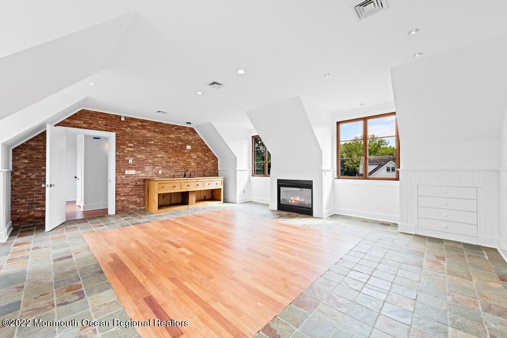 Empty room, Fireplace, Interior, Recessed Lighting, Stone Walls, Wood Texture Flooring