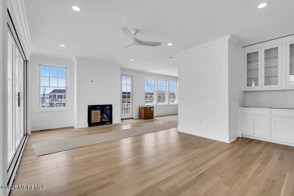 Empty room, Fireplace, Interior, Recessed Lighting, Wood Texture Flooring