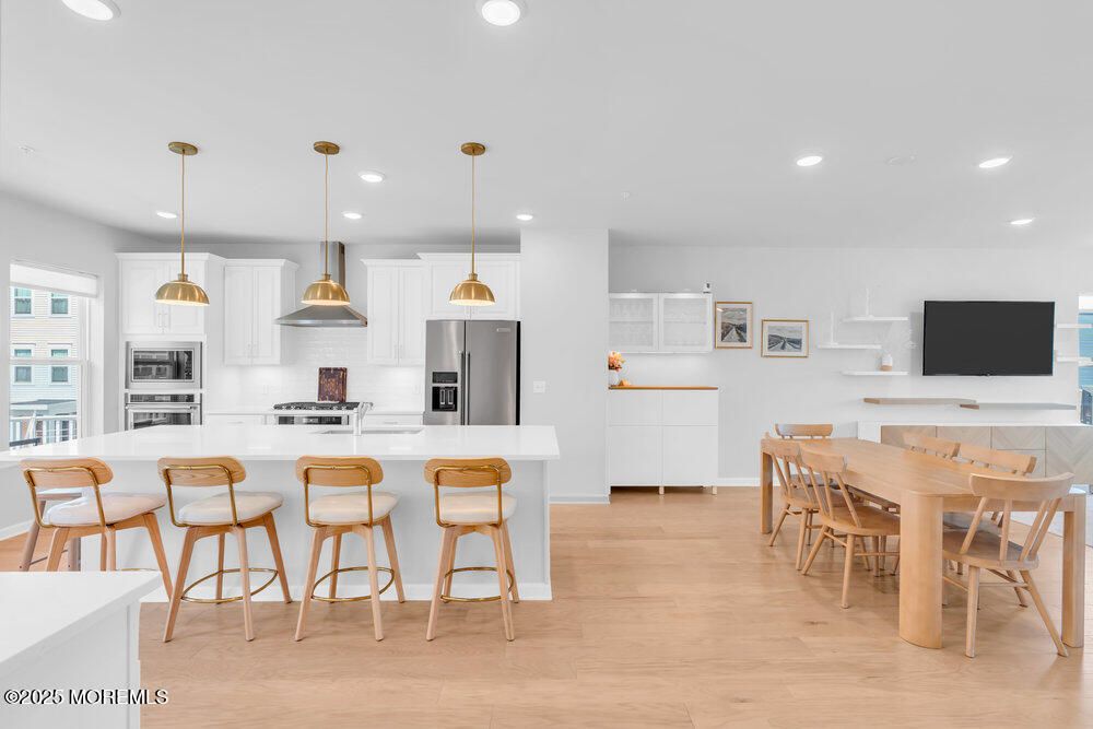 Dining room, Interior, Kitchen, Pendant Lights, Recessed Lighting, Stainless Steel Appliances, Wood Texture Flooring
