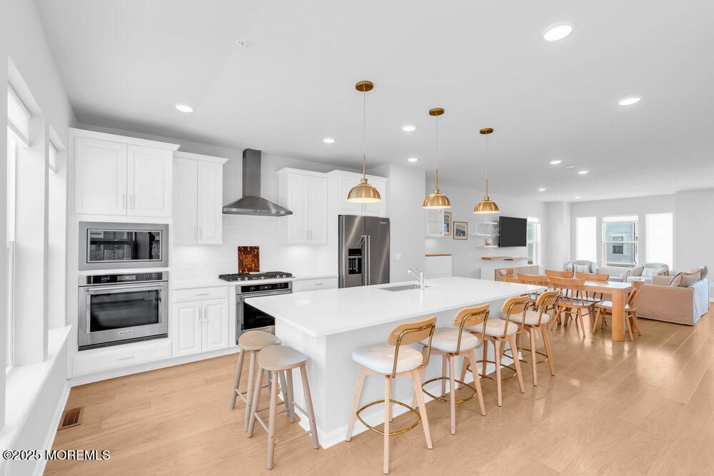 Dining room, Interior, Kitchen, Living room, Pendant Lights, Recessed Lighting, Stainless Steel Appliances, Wood Texture Flooring