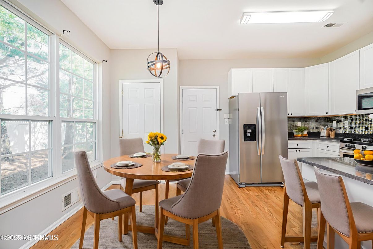 Dining room, Interior, Kitchen, Pendant Lights, Stainless Steel Appliances, Wood Texture Flooring