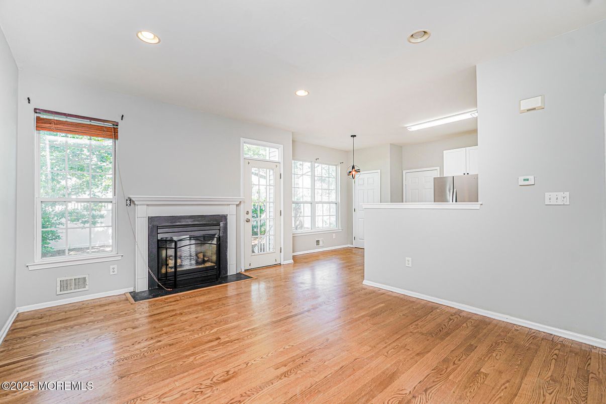 Empty room, Fireplace, Interior, Pendant Lights, Recessed Lighting, Wood Texture Flooring