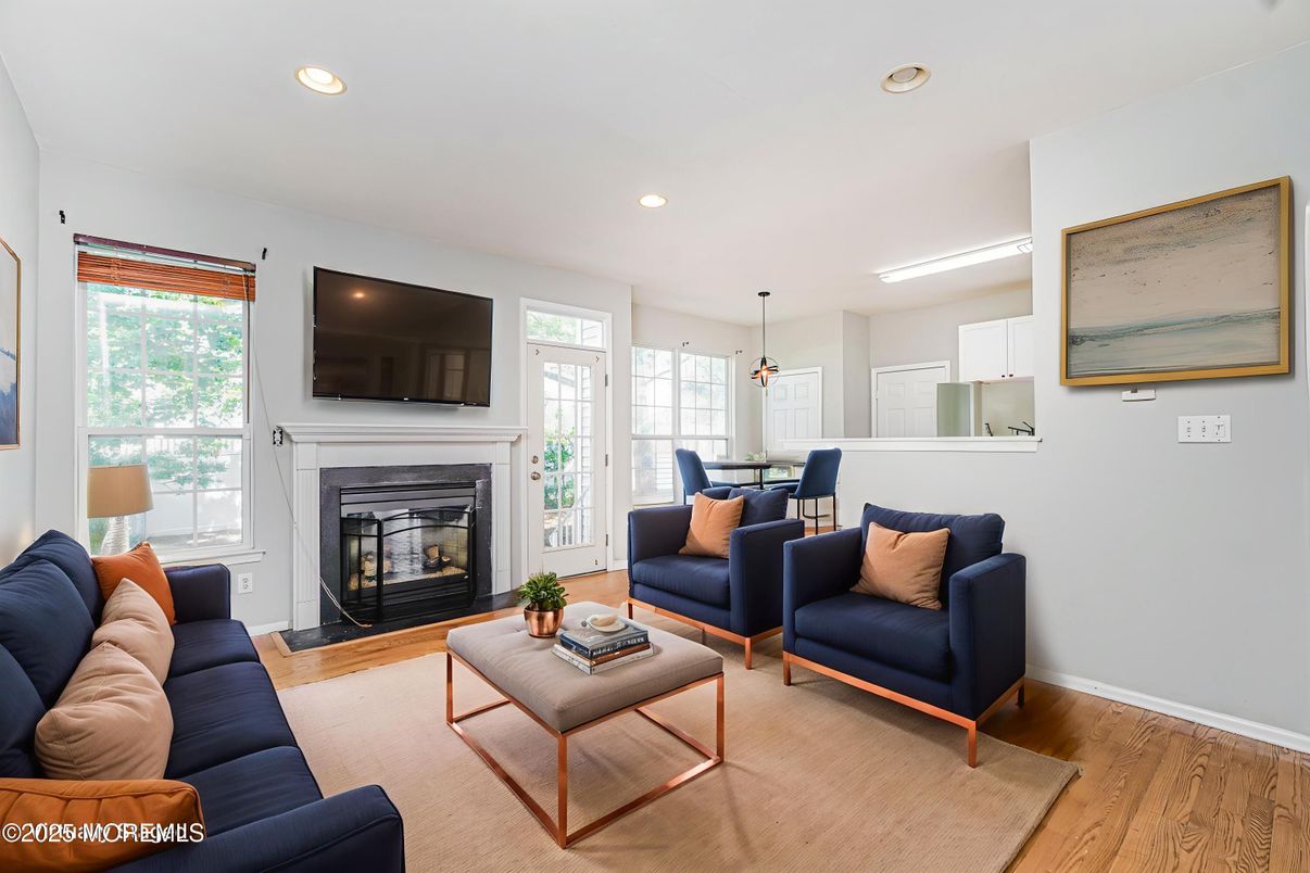 Dining room, Fireplace, Interior, Living room, Pendant Lights, Recessed Lighting, Wood Texture Flooring