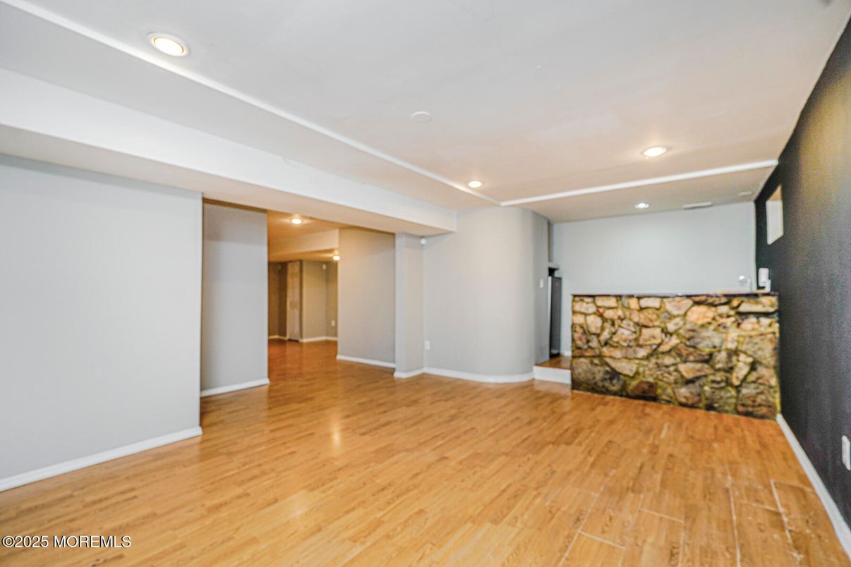 Empty room, Interior, Recessed Lighting, Stone Walls, Wood Texture Flooring