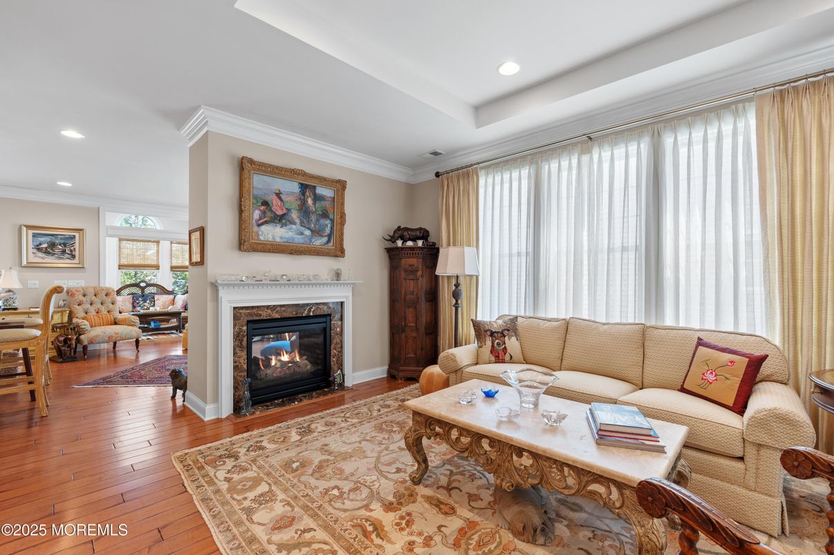 Dining room, Fireplace, Interior, Living room, Recessed Lighting, Wood Texture Flooring