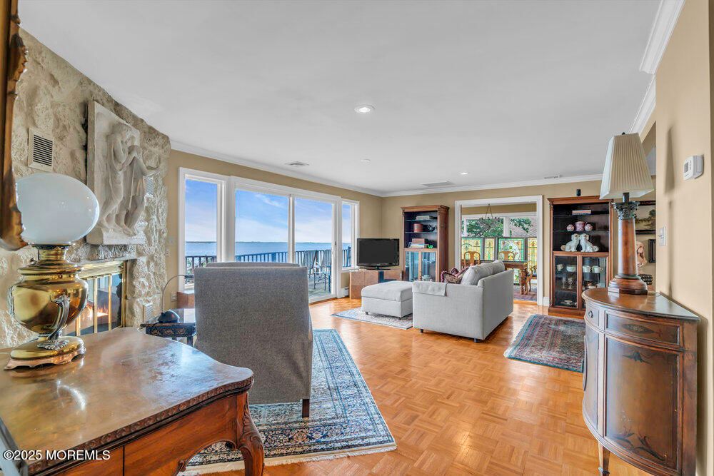 Fireplace, Interior, Living room, Recessed Lighting, Water, Wood Texture Flooring
