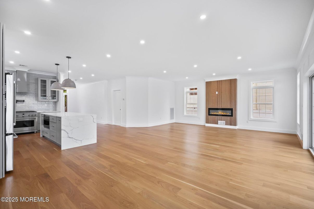 Fireplace, Interior, Kitchen, Pendant Lights, Recessed Lighting, Stainless Steel Appliances, Wood Texture Flooring