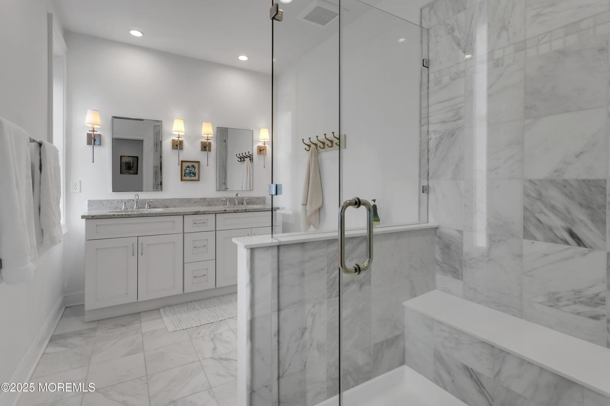 Bathroom, Dual Sink Vanities, Glass Shower, Interior, Marble, Marble Walls, Recessed Lighting