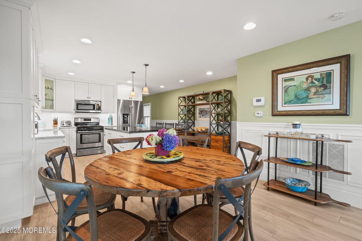 Dining room, Interior, Kitchen, Pendant Lights, Recessed Lighting, Stainless Steel Appliances, Wood Texture Flooring