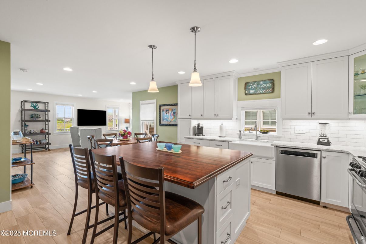 Dining room, Interior, Kitchen, Pendant Lights, Recessed Lighting, Stainless Steel Appliances, Wood Texture Flooring