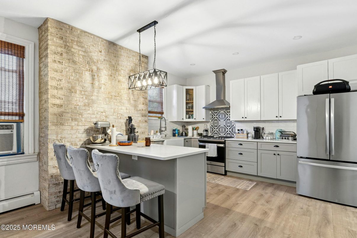 Interior, Kitchen, Pendant Lights, Recessed Lighting, Stainless Steel Appliances, Stone Walls, Wood Texture Flooring