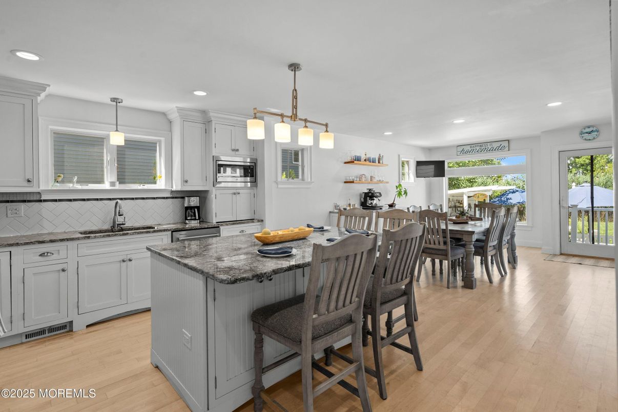 Dining room, Interior, Kitchen, Pendant Lights, Recessed Lighting, Stainless Steel Appliances, Wood Texture Flooring