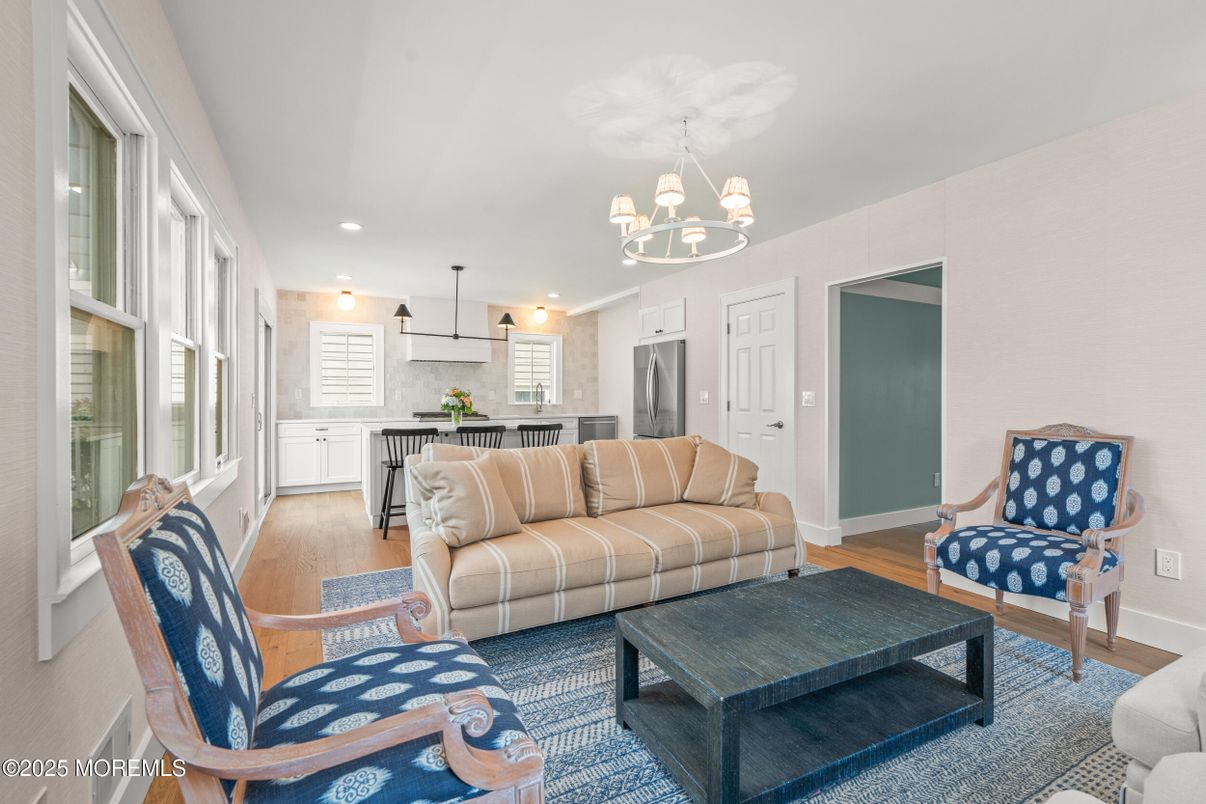 Chandelier, Interior, Kitchen, Living room, Recessed Lighting, Stainless Steel Appliances, Wood Texture Flooring
