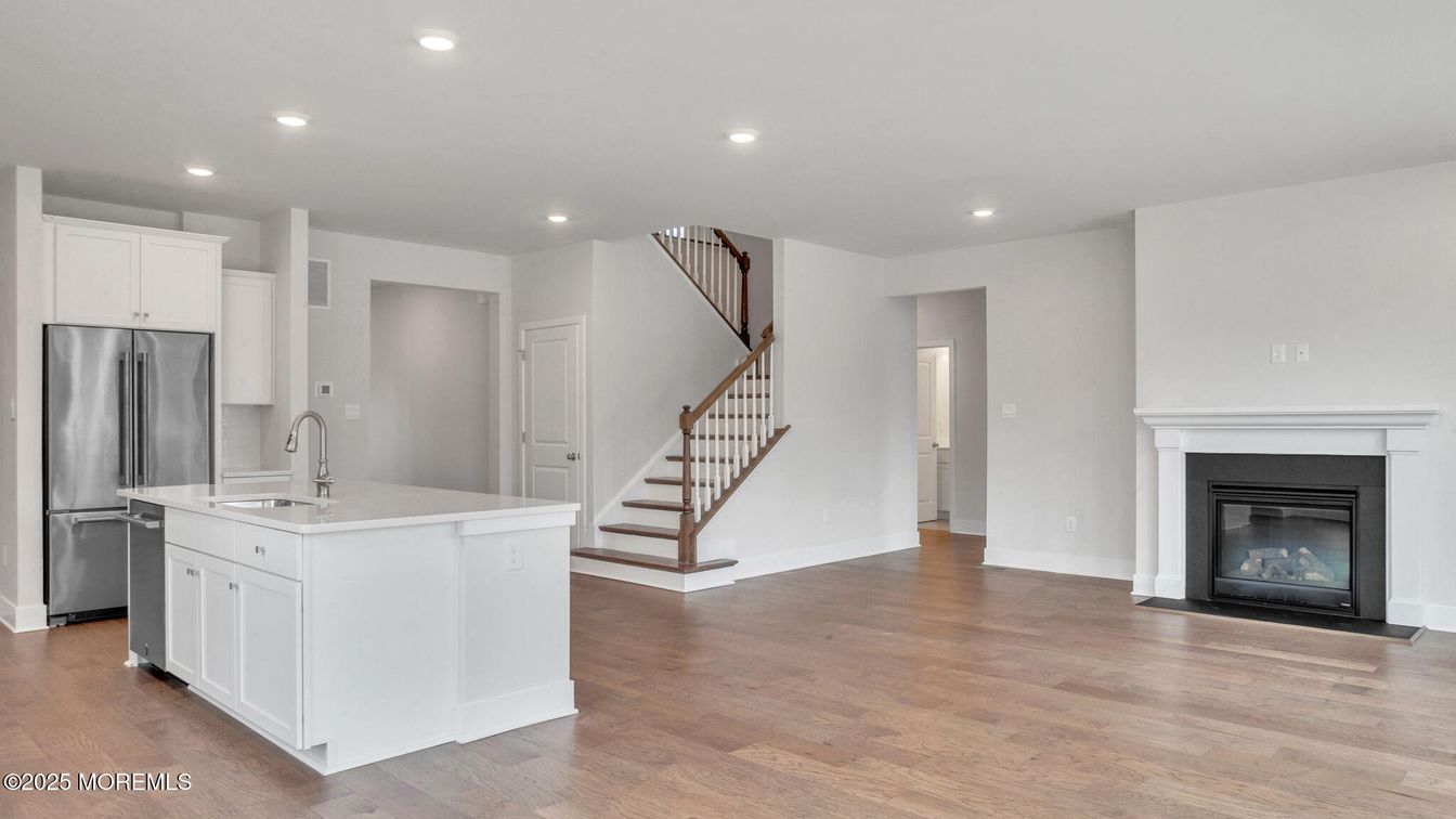 Fireplace, Interior, Kitchen, Recessed Lighting, Stainless Steel Appliances, Wood Texture Flooring