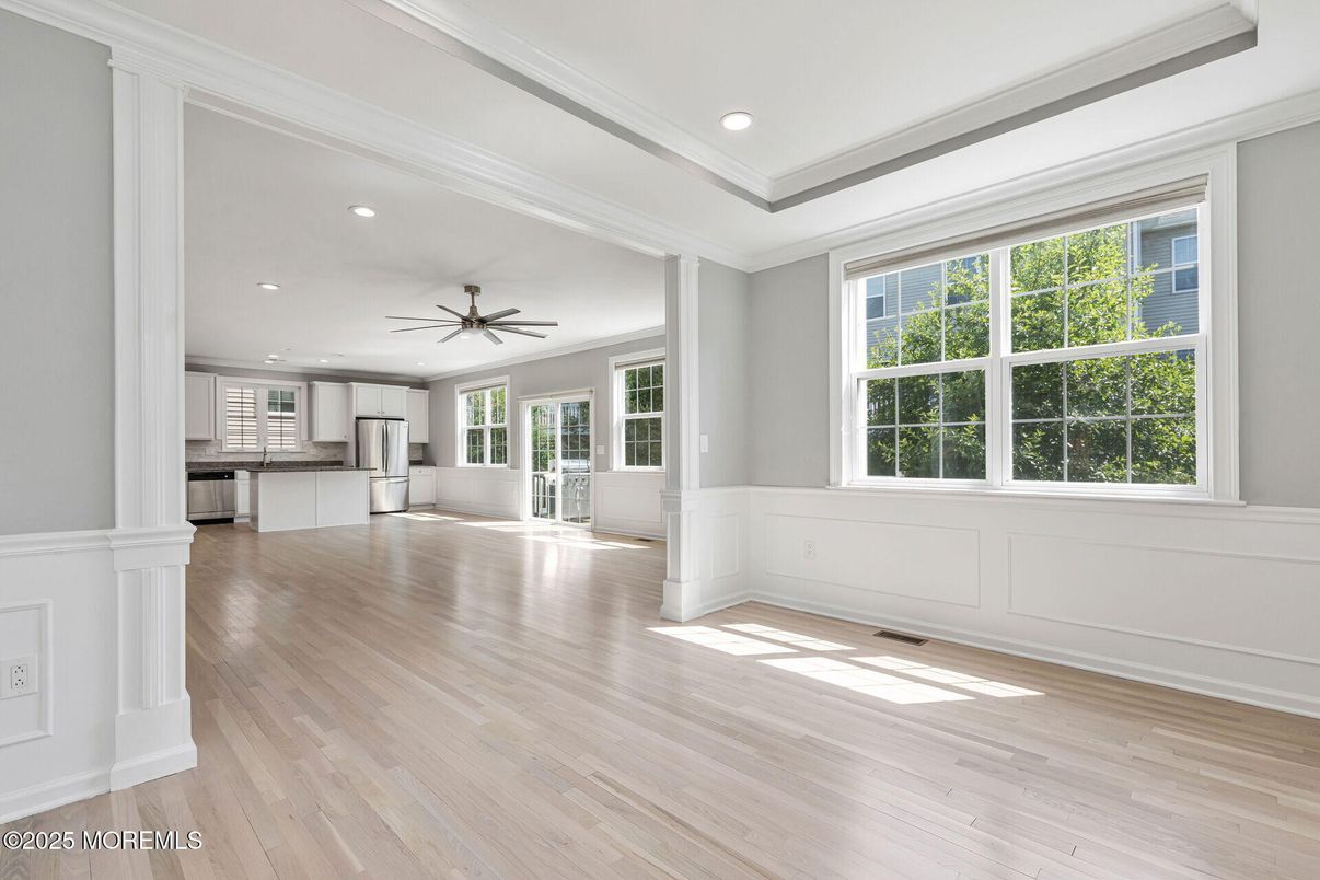 Empty room, Interior, Kitchen, Recessed Lighting, Stainless Steel Appliances, Wood Texture Flooring