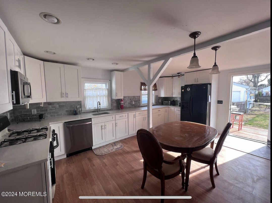 Dining room, Interior, Kitchen, Pendant Lights, Stainless Steel Appliances, Wood Texture Flooring